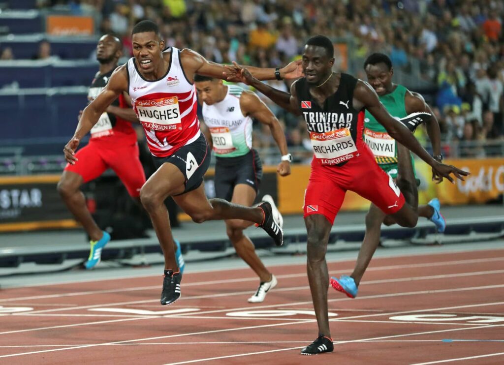 England's Zharnel Hughes, left, and TT's Jereem Richards compete in the men's 200m final at Carrara Stadium during the Commonwealth Games on the Gold Coast, Australia, Thursday. (AP Photo)