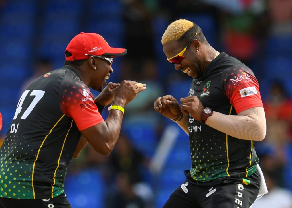 Dwayne Bravo (left) and Fabian Allen of St Kitts/Nevis Patriots celebrate the dismissal of Chanderpaul Hemraj of Guyana Amazon Warriors during the 2021 Hero Caribbean Premier League match  between St Kitts/Nevis Patriots and Guyana Amazon Warriors at Warner Park Sporting Complex in Basseterre, St Kitts, on August 29, 2021. (Photo by CPL T20/Getty Images) - 