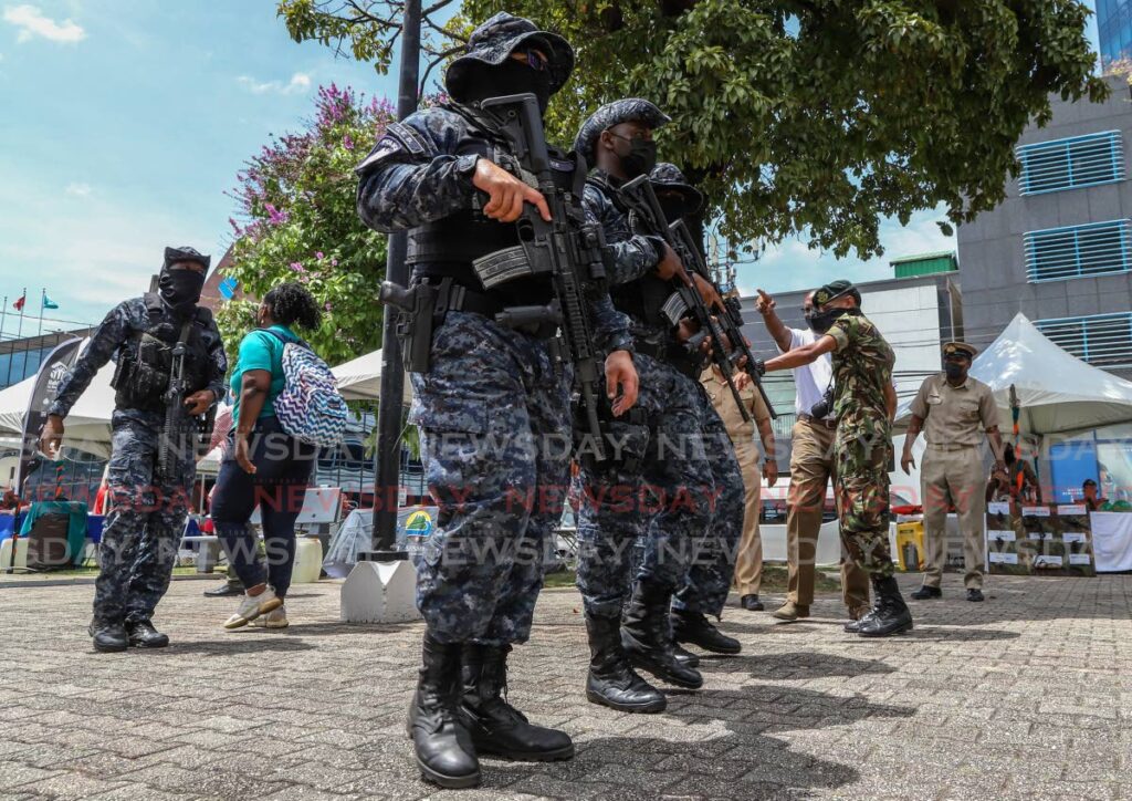 File photo: Heavily armed police patrol Brian Lara Promenade, Port of Spain.