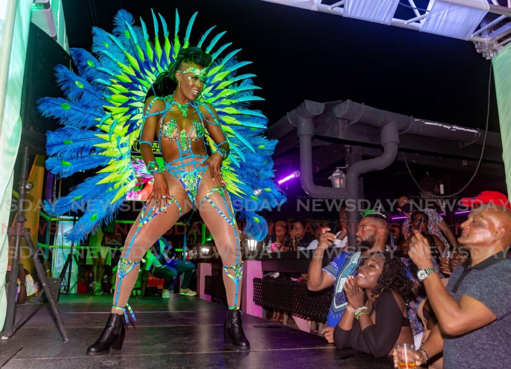 A model shows off a costume from the Breathless section of A Tribute to Blaxx, a mas band put out by Jade Monkey Bar and Grill in collaboration with Ronnie and Caro, at the band launch in Crown Point. FILE PHOTO/DAVID REID - 