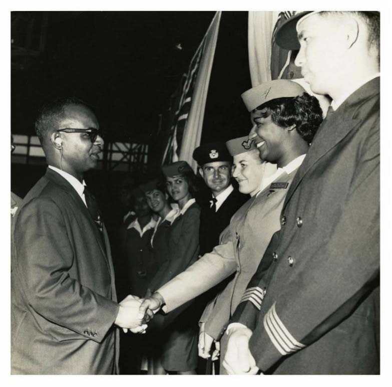 Pearl Marshall and other BWIA flight crew members meet meet TT's first Prime Minister Dr Eric Williams. Photo by Eugene Borde - 