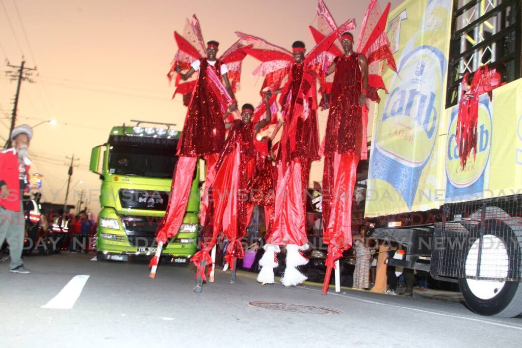 ARIAPITA JUMBIES: Moko Jumbies on Ariapita Avenue during the launch of Tribe’s Sunset Weekend. Photo by Roger Jacob