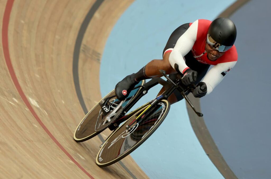 Nicholas Paul of Trinidad and Tobago rides in the men's 1000m time trial final during the Commonwealth Games track cycling at Lee Valley VeloPark in London, England on Monday. (AP PHOTOS)  