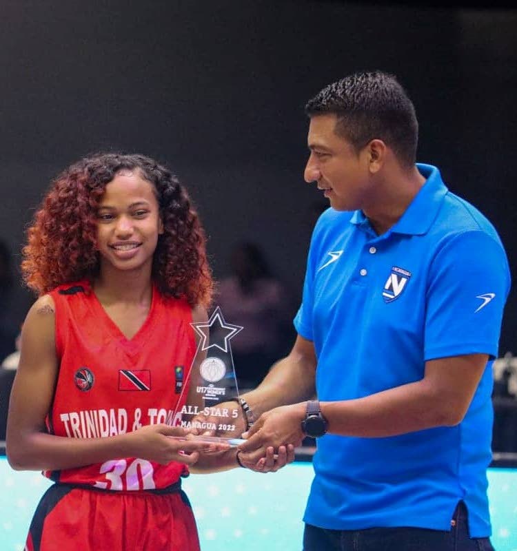 TT's Carissa Ramdial receives an award for making the U17 Centrobasket Qualifiers All Star Five team on Monday.  - 