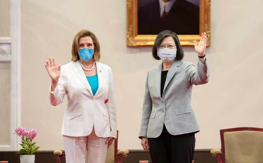 US House Speaker Nancy Pelosi and Taiwanese President Tsai Ing-wen wave during a meeting Wednesday in Taipei. Taiwan Presidential Office via AP - 