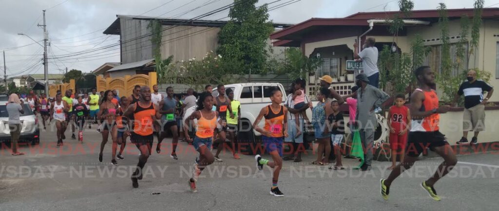 Competitors take off in the Walke Street Emancipation Committee Feedom Run 5K in Sangre Grande on Monday.  Photo by Stephon Nicholas