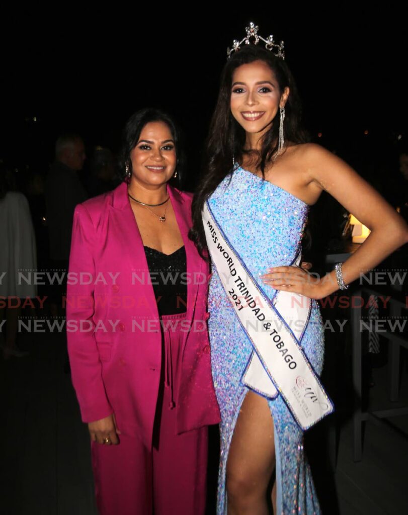 Fashion Designer Charu Lochan Dass, left,  franchise holder of Miss World TT pageant and reigning Miss World TT Jeanine Brandt at the launch of Miss World TT 2022 at Brix Autograph Collection on August 3. - Sureash Cholai