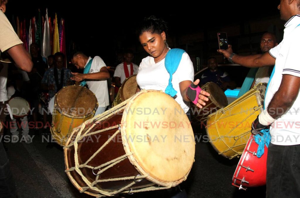 A female tassa drummer performs during Flag Night at Hosay celebrations in St James on Friday night. - Photo by Ayanna Kinsale