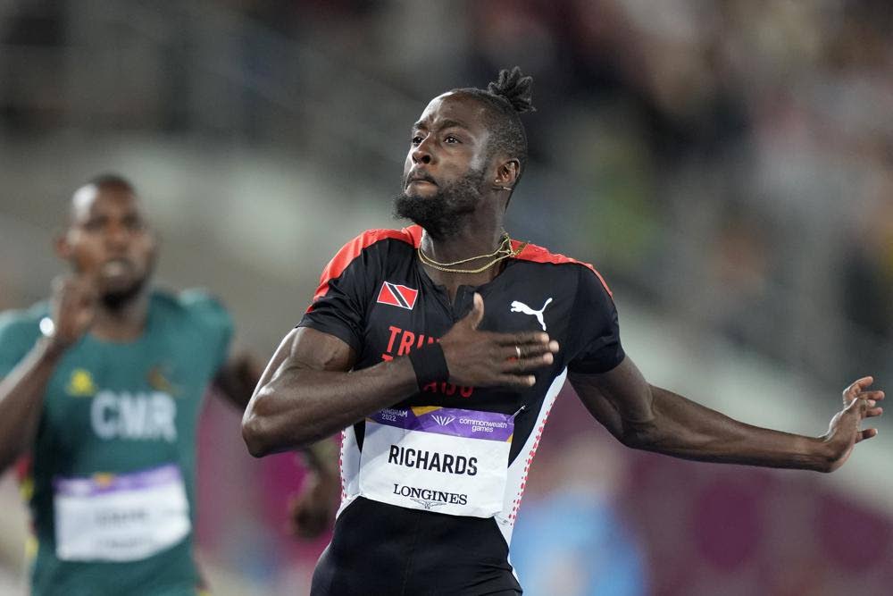 Jereem Richards of Trinidad and Tobago celebrates after winning the gold medal in the men's 200 metres during the athletics competition in the Alexander Stadium at the Commonwealth Games in Birmingham, England, on August 6. (AP PHOTO) - 