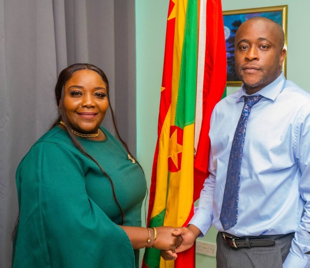 Assistant Secretary of Tourism Meghan Morrison, left, greets Grenada Permanent Secretary with responsibility for Youth, Sports, and Culture, Norman Gilbert, in Grenada last Friday.  - THA