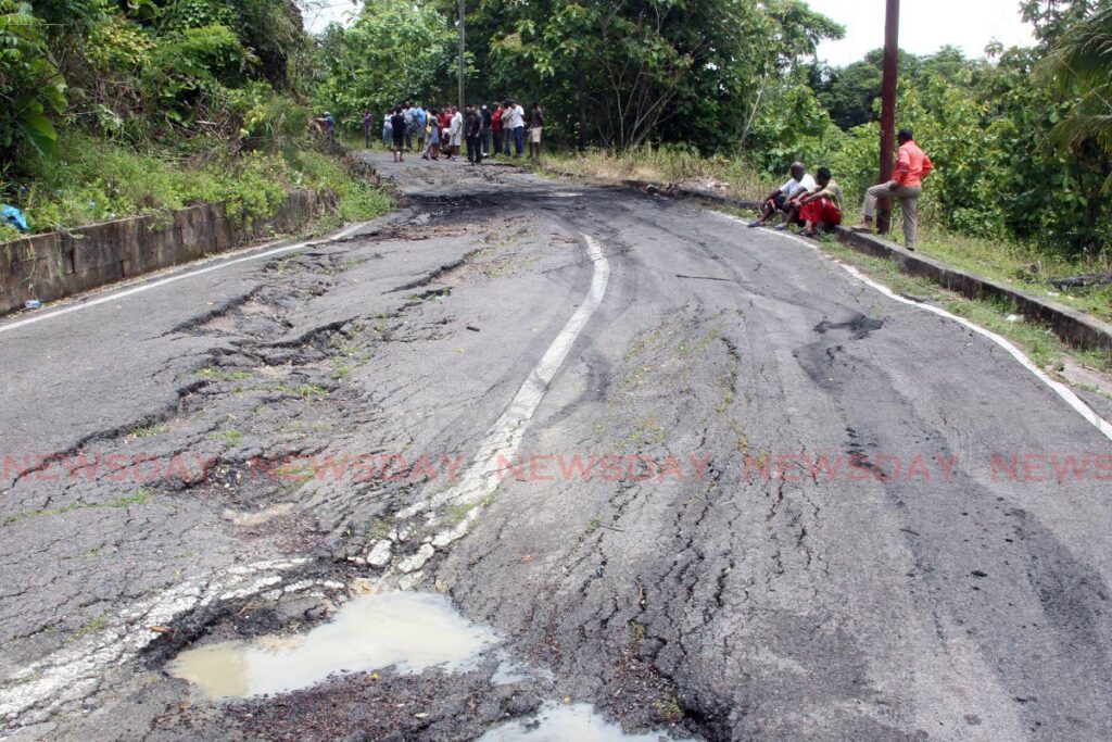 Residents of the eight-and-a-half mile mark along the Penal Rock road, staged a protest to highlight the bad roads and poor infrastructure in their area on Tuesday. - Lincoln Holder