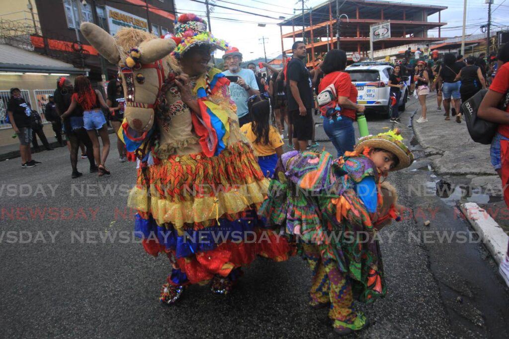 Venezuelans parade during Arima Borough Day celebrations on Saturday. - Photo by Angelo Marcelle