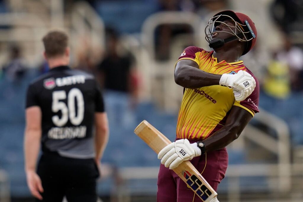 West Indies captain Rovman Powell celebrates hitting a six to defeat New Zealand by eight wickets during the third T20 at Sabina Park in Kingston, Jamaica, Sunday. (AP Photo)