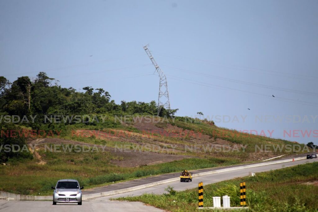 The damaged TTEC electrical tower along the Solomon Hochoy Highways near Grant Trace Rousillac which was responsible for a power outage that affected 30% of the country due to a landslip on the night of August 16. Photo by Lincoln Holder