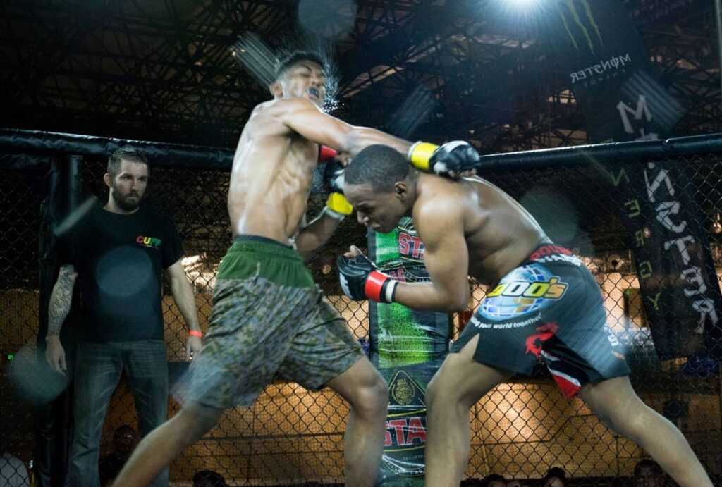 Fighters exchange blows in a past Caribbean Ultimate Fist Fighting Championship. PHOTO COURTESY CUFF  - 