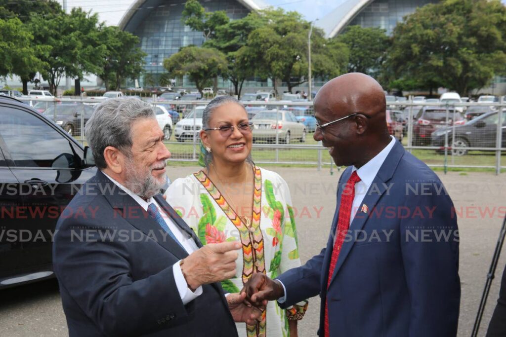 Prime Minister Dr Keith Rowley greets St Vincent & the Grenadines Prime Minister Dr Ralph Gonsalves
and his wife Eloise Harris as they arrive at the Agri Investment Forum and Expo at the Queen Park Savannah in Port of Spain on Friday. - SUREASH CHOLAI