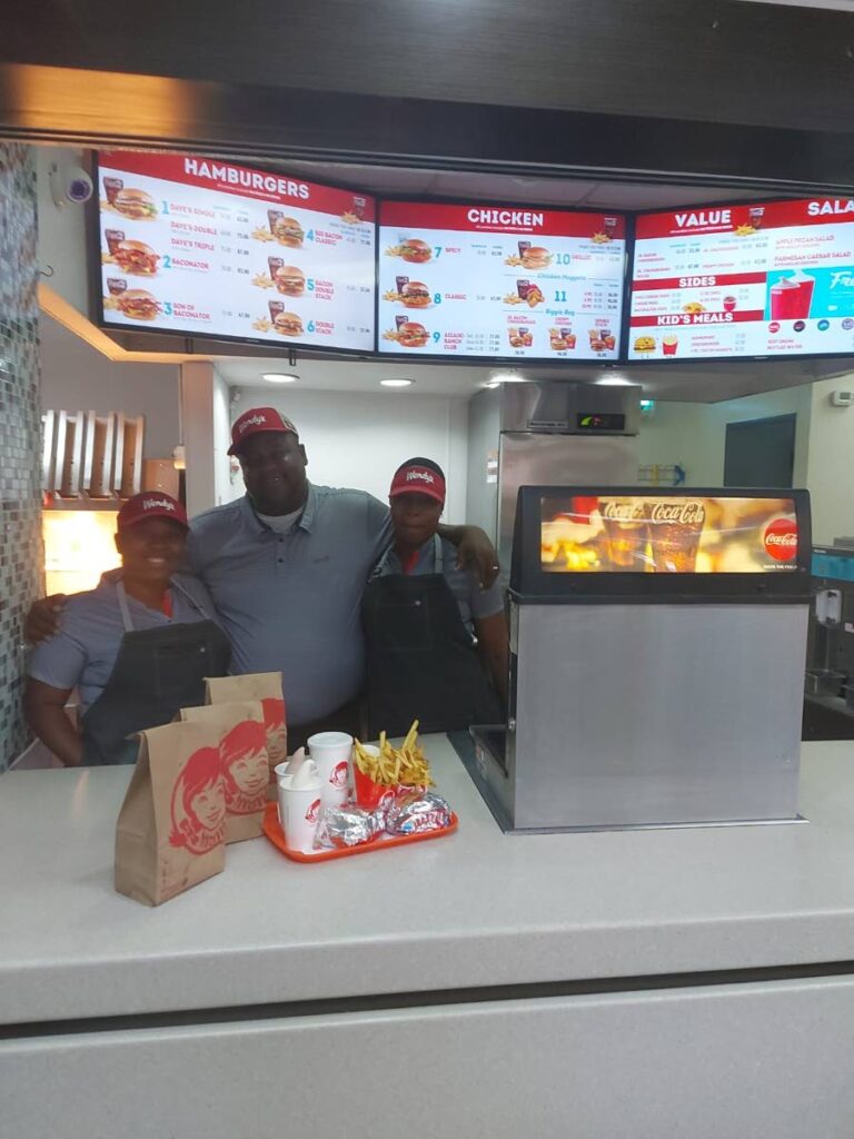 Wendy's customer service attendants. The fast food chain reopens under Quick Service Holdings. - 