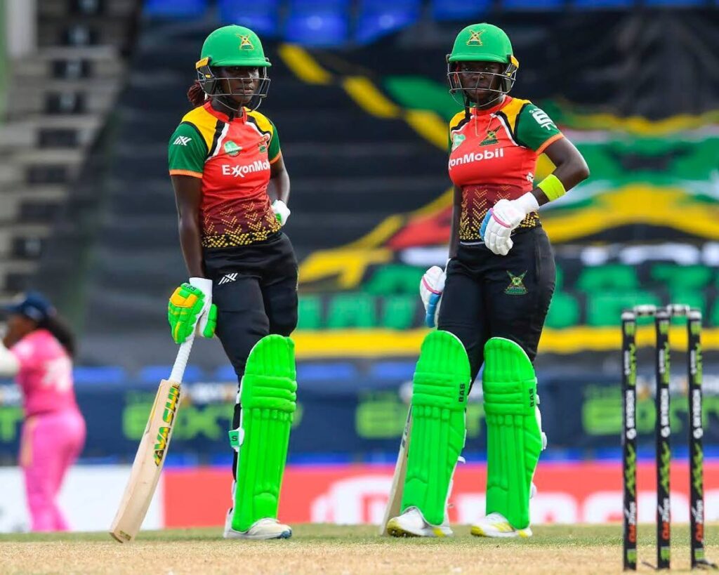 Guyana Amazon Warriors women's team captain Stafanie Taylor (left) and Rashada Williams chat during their innings against Barbados Royals during their women 6ixty match at Warner Park, Basseterre, St Kitts on Wednesday. PHOTO COURTESY 6IXTY CRICKET FACEBOOK PAGE. - 