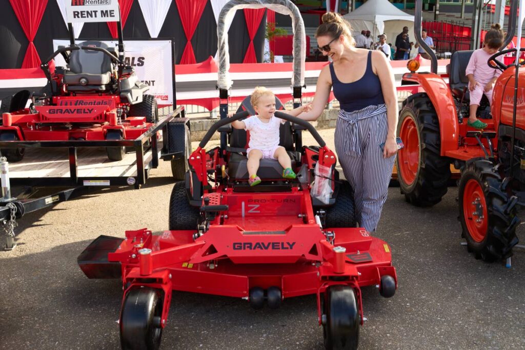 A tiny tot rides an industrial lawn mower at the Agri-investment Forum and Expo held last weekend. Photo courtesy FT Farfan 