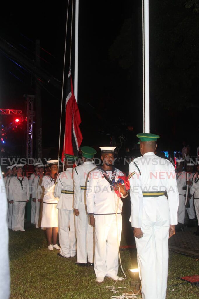 Members of the TT Defence Force and Coast Guard stand at attention at the flag raising re-enactment ceremony during the 50th anniversary of independence celebrations held at Woodford Square, Port of Spain, on August 30 2012. - File Photo