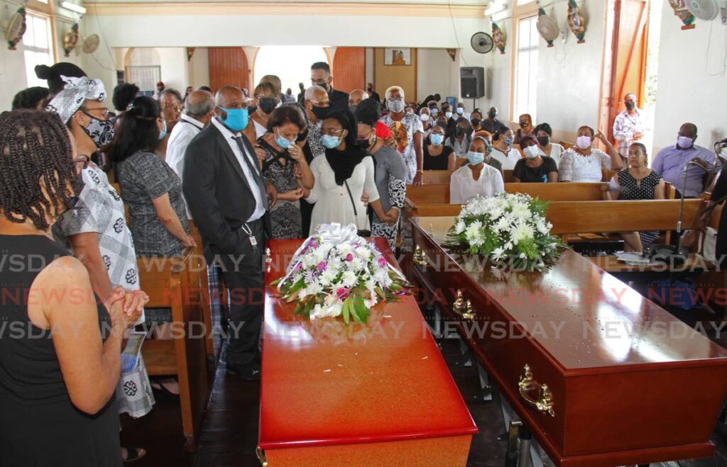 Mourners at the funeral for Carltus 