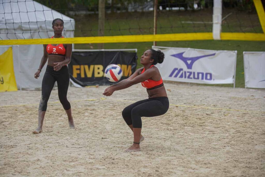 TT's Britney Choon receives the ball alongside her partner Tsyan Selvon in a Cazova under-23 beach volleyball match in Santa Cruz over the weekend. - 