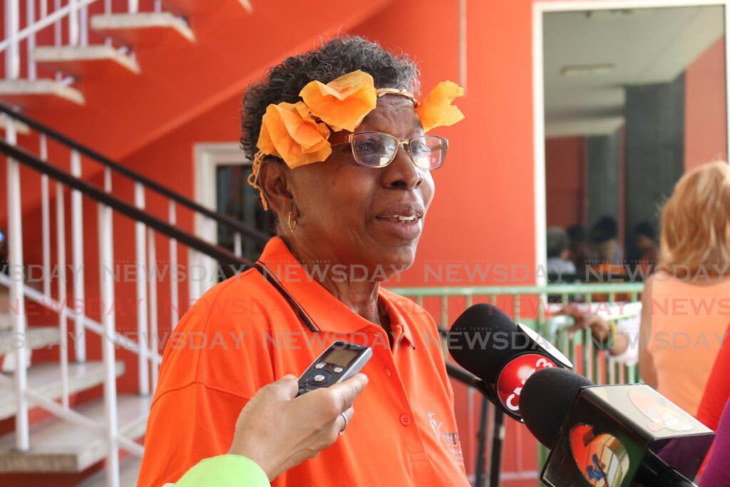 Hazel Brown wears orange in support of a campaign to end violence against women during the launch at City Hall, Port of Spain in 2016.