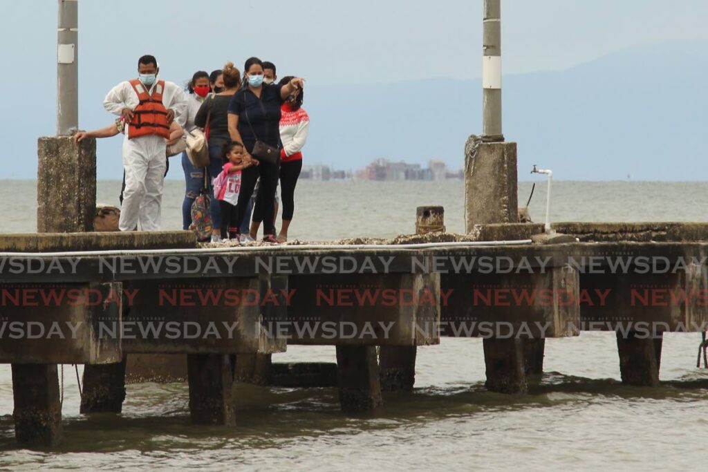 FLASHBACK: In this file photo, a Venezuelan family arrives at the port in Cedros.  Many Venezuelans are still unable to send their children to local schools although they have been granted legal status by the TT Government. 