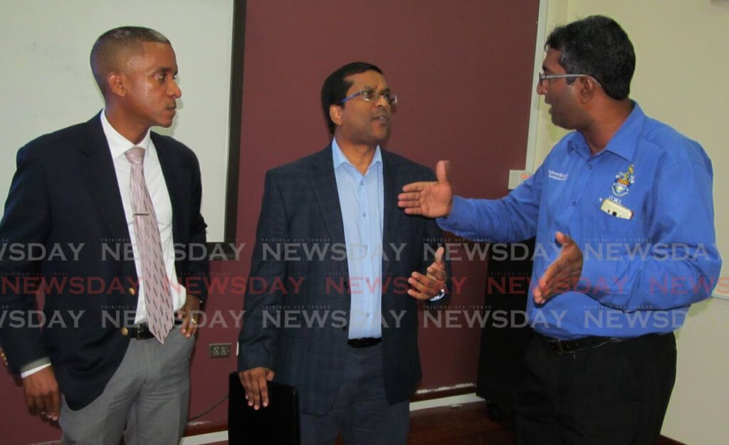 SPOILT ON SUBSIDIES: Economists Dr Darren Conrad, left, and Dave Seerattan, centre, who said on Thursday that decades of governnment grants and subsidies have left TT citizens spoilt. In this photo, both are seen with another economist Roger Hosein. File Photo 