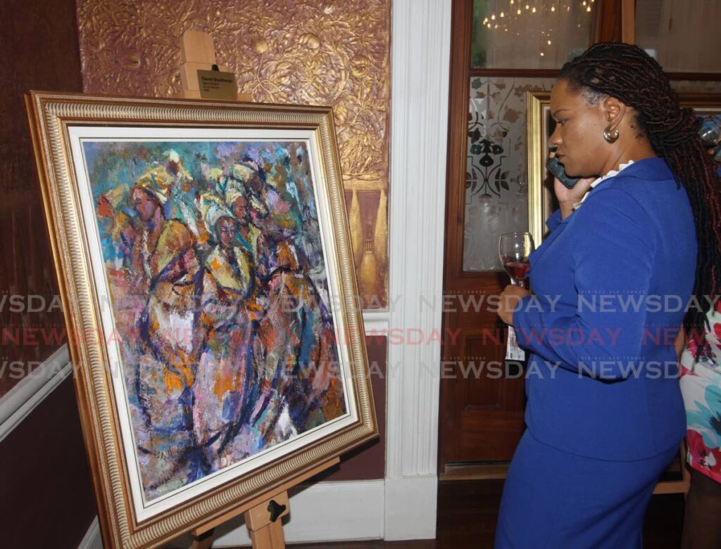 Minister Ayanna Webster-Roy views a 1982 painting by David Bootman at the art exibition at Whitehall. - Angelo Marcelle