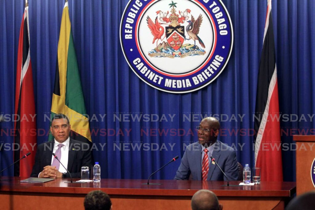 Prime Minister of Jamaica Andrew Holness, left, and Prime Minister Dr Keith Rowley, address the media at the Diplomatic Centre, St Ann's on August 29. - ANGELO MARCELLE