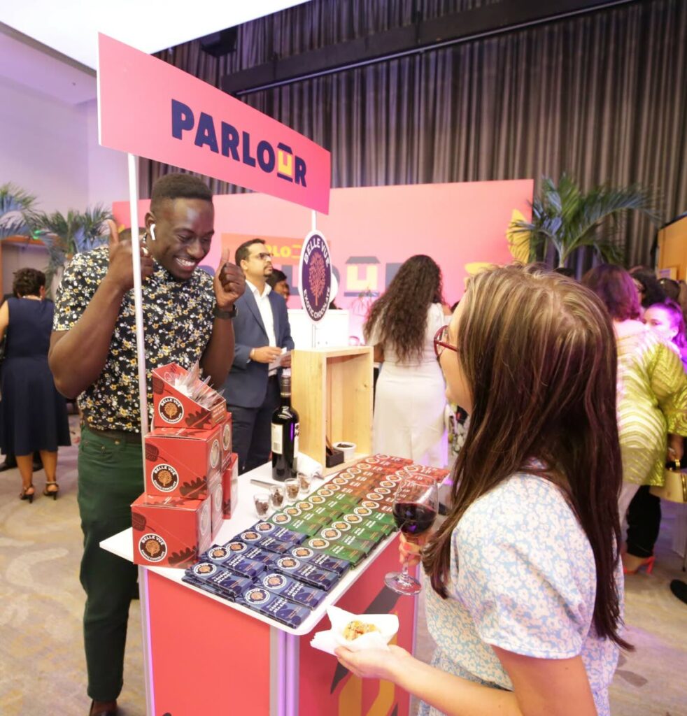  Makesi Paul, founder of BelleVue Exotic Chocolates, gives two thumbs up during a chat at the launch of Parlour at the Hyatt Regency, Port of Spain on August 27. Photo courtesy TSTT - 