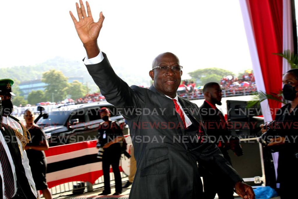 Prime Minister Rowley waves as he arrives for the Independence Day Parade at the Queen's Park Savannah. - Sureash Cholai
