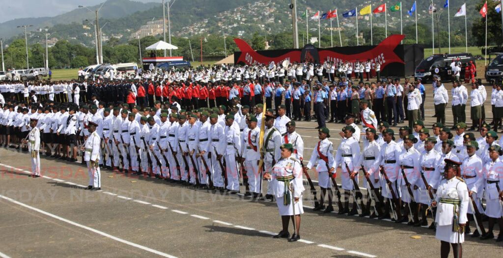 The Scouts Association of TT, the Military-Led Academic Training Programme, and the Seventh-day Adventist Pathfinders and other groups await inspection at the Independence Day parade at the Queen's Park Savannah, Port of Spain, on Wednesday. - Sureash Cholai