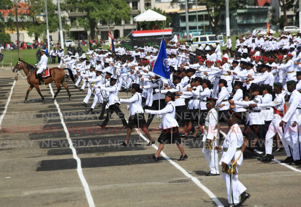 Members of the Police Service take part in the Independence Day parade at the Queen's Park Savannah on Wednesday. - Photo by Sureash Cholai