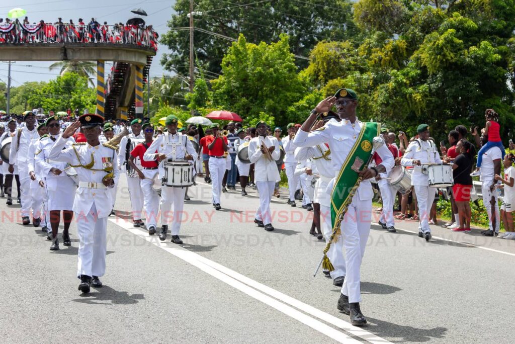 The Tobago Cadet Academy salutes during the 60th independence anniversary parade along the Claude Noel Highway, Scarborough, Wednesday. - David Reid