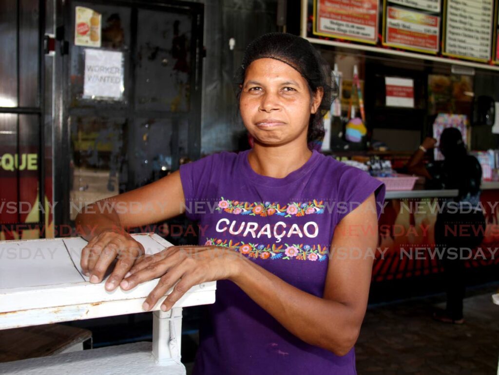 Ann Marie Singh on her job at Slims BBQ, Southern Main Road, Rousillac.  - AYANNA KINSALE