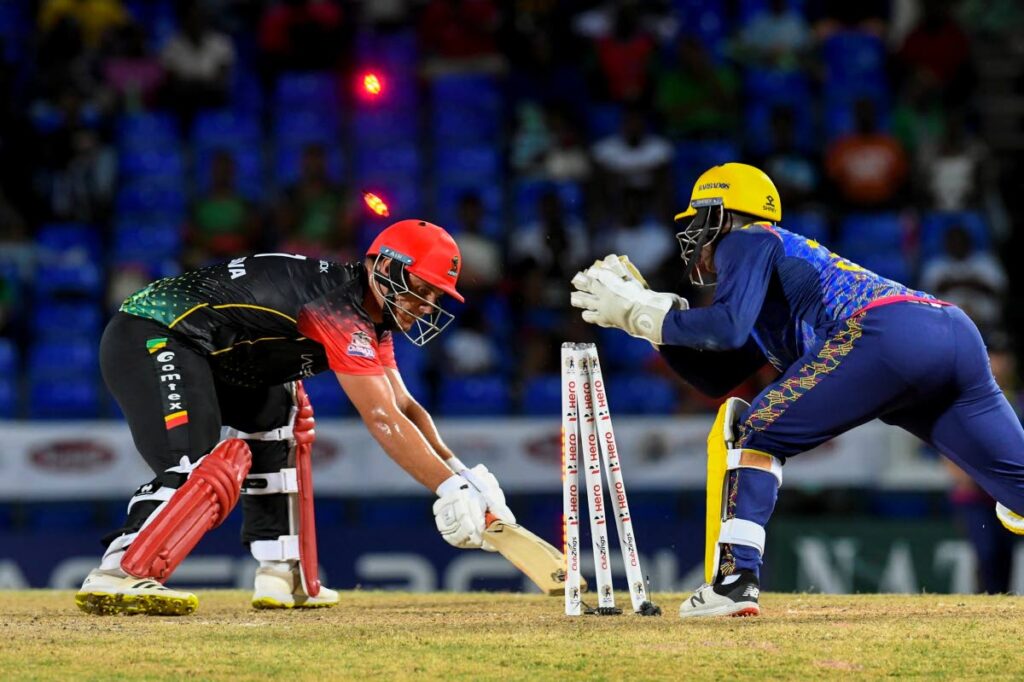 St Kitts/Nevis Patriots batsman Joshua Da Silva (left) is stumped by Barbados Royals wicketkeeper Devon Thomas (right) during the teams' 2022 Hero Caribbean Premier League (CPL) match at Warner Park, Basseterre, St Kitts on Thursday. PHOTO COURTESY CARIBBEAN PREMIER LEAGUE. - 