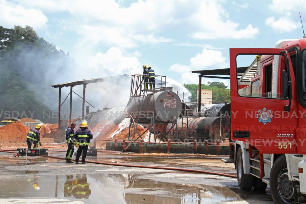 Firefighters responded to a fire at Junior Sammy’s asphalt plant in Claxton Bay on Friday. - Marvin Hamilton