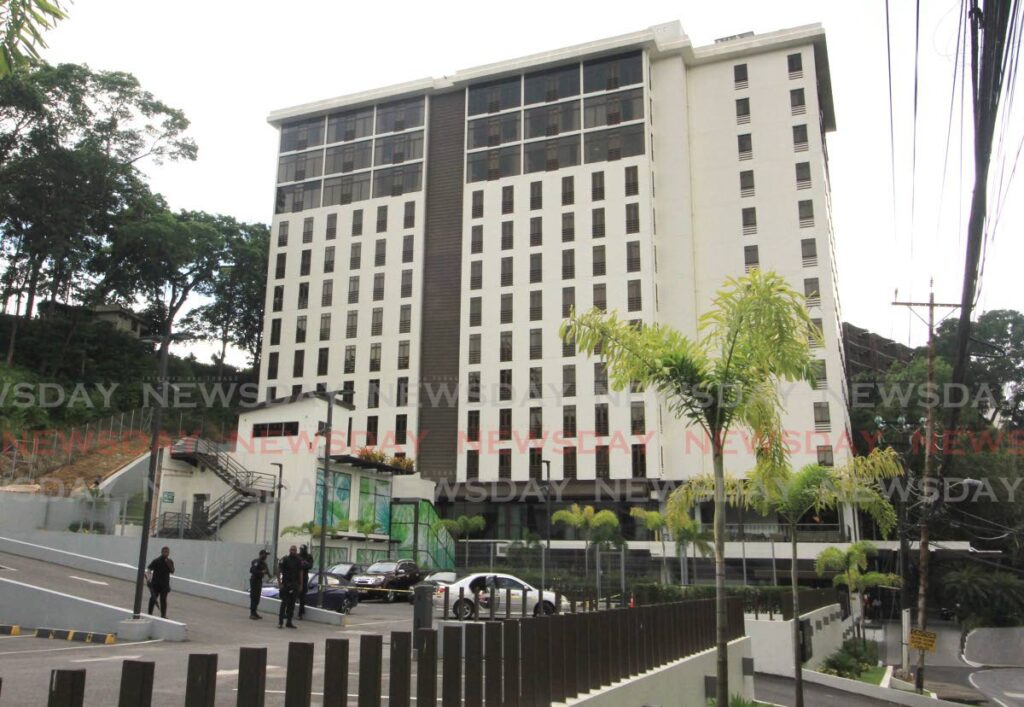 Police on the scene of a fatal shooting at the carpark of the Brix Hotel in Port of Spain on Friday. - Angelo Marcelle