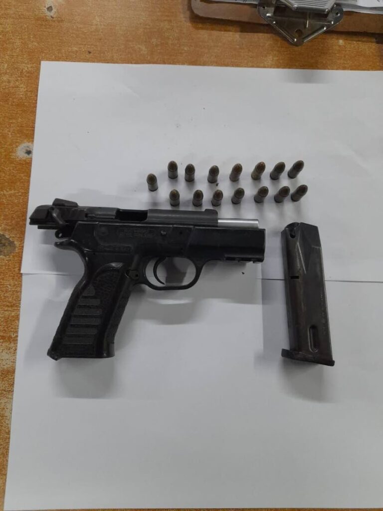 A pistol and a quantity of ammunition found by police during an exercise in Claxton Bay on Thursday - 