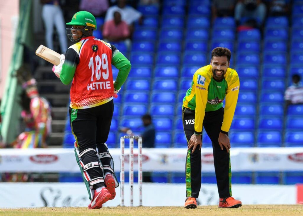 Jamaica Tallawahs fast bowler Mohammad Amir (right) and Guyana Amazon Warriors batsman Shimron Hetmyer are all smiles during their teams' match in the Hero Caribbean Premier League (CPL), at Warner Park, Basseterre, St Kitts on Saturday. PHOTO COURTESY CARIBBEAN PREMIER LEAGUE. - 