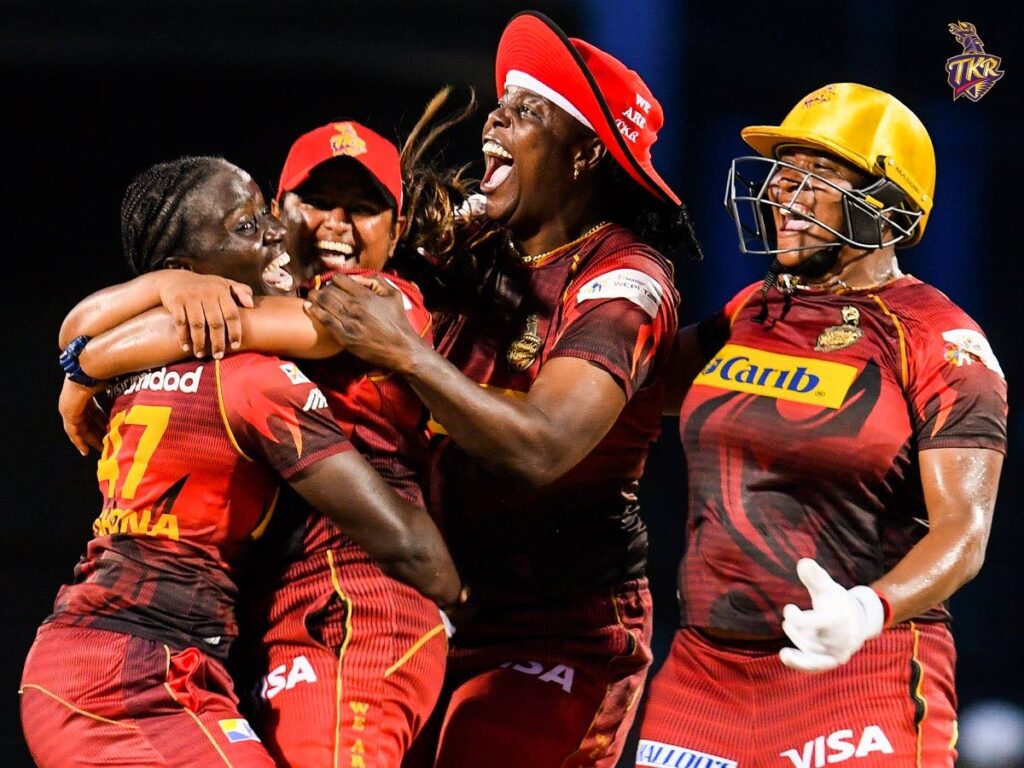 Trinbago Knight Riders captain Deandra Dottin, left, hugs spinner Anisa Mohammed after her team beat Barbados Royals in the Massy CPL final on Sunday in St Kitts. Photo Trinbago Knight Riders