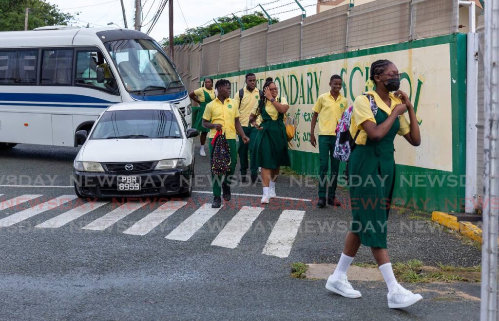 Signal Hill Secondary students arrive for the first day of the new school year on Monday. School was later dismissed owing to the poor turnout of teachers who heeded TTUTA's call to stay home to rest and reflect on the CPO's four per cent offer for salary increase. - DAVID REID