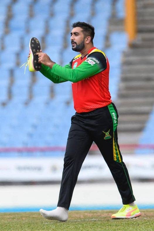 Guyana Amazon Warriors left-arm spinner Tabraiz Shamsi takes off his right shoe to celebrate the dismissal of St Kitts/Nevis Patriots batsman Dewald Brevis during the teams' Hero Caribbean Premier League (CPL) match at the Darren Sammy Stadium, Gros Islet, St Lucia on Thursday. Photo courtesy Caribbean Premier League