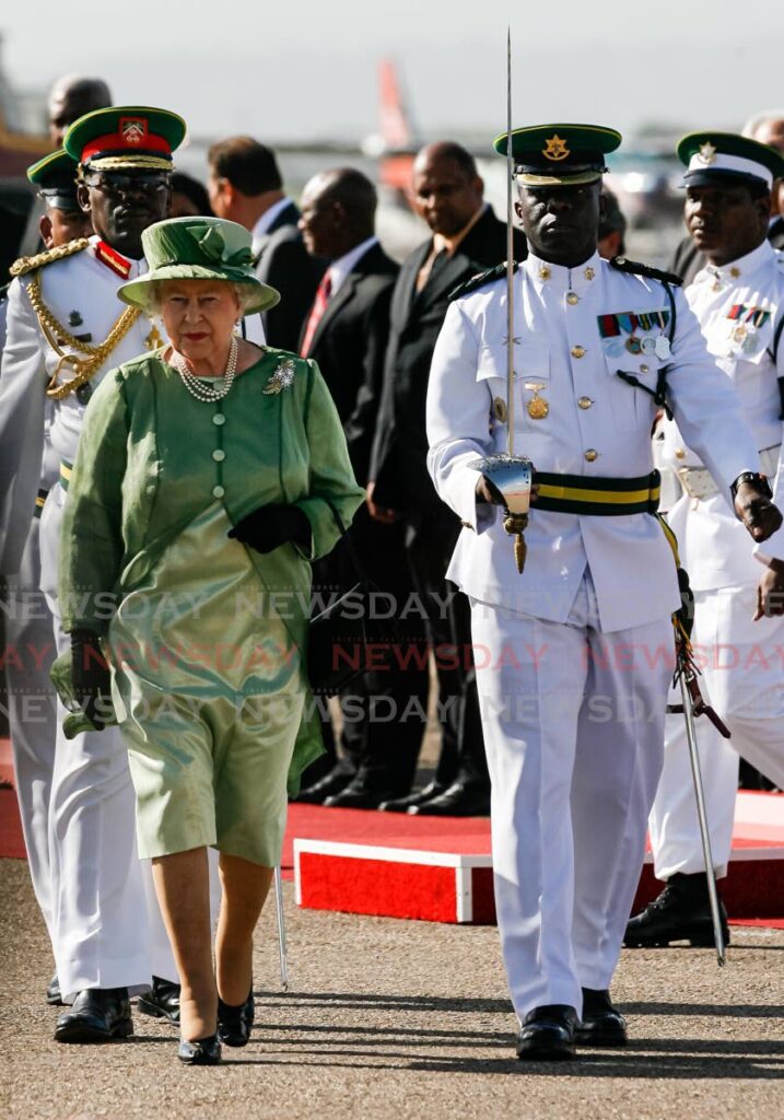 FILE PHOTO: Queen Elizabeth II arrives at the Piarco International Airport for a Commonwealth heads of government meeting (CHOGM) on November 26, 2009. 