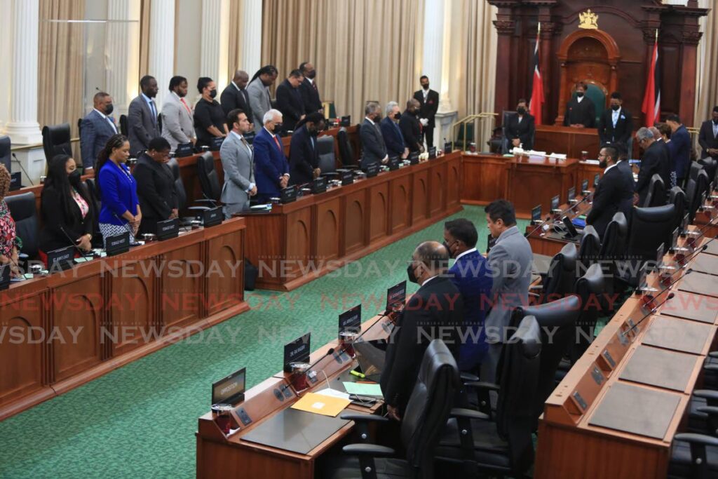 Members of the House of Representives stand for a minute of silence in Parliament on Friday, in honour of the passing of Queen Elizabeth on Thursday. - Sureash Cholai