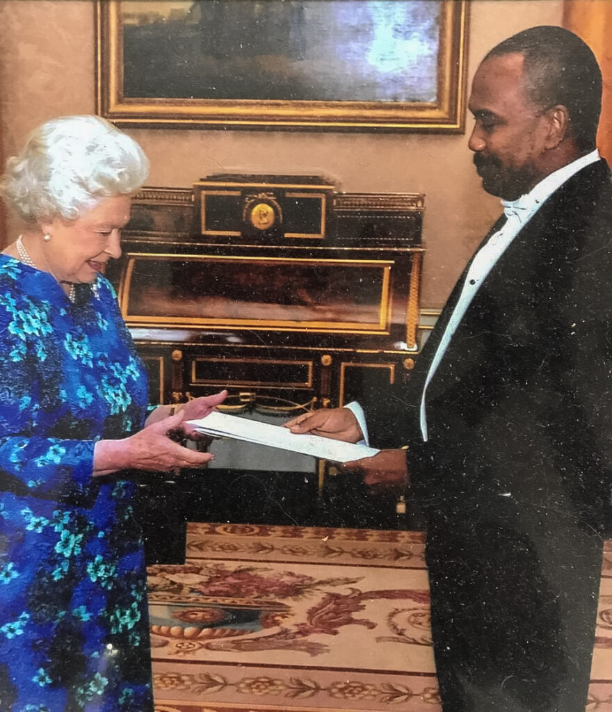 John Jeremie, SC, presents Queen Elizabeth II with his credentials as TT high commissioner to the UK at Buckingham Palace in 2018.