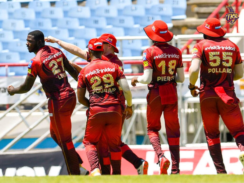 Trinbago Knight Riders pace bowler Shaaron Lewis (left) is congratulated by his teammates after taking a wicket during the team's Hero Caribbean Premier League match against Jamaica Tallawahs at the Daren Sammy Stadium, Gros Islet, St Lucia on Saturday. PHOTO COURTESY CARIBBEAN PREMIER LEAGUE.  