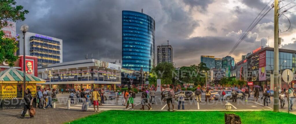A multi-layered image showing the bustle along the Brian Lara Promenade, Port of Spain. Photo by Jeff K Mayers
